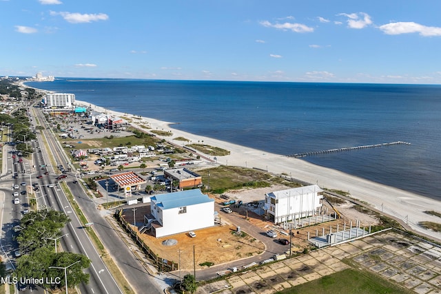 aerial view featuring a water view and a beach view