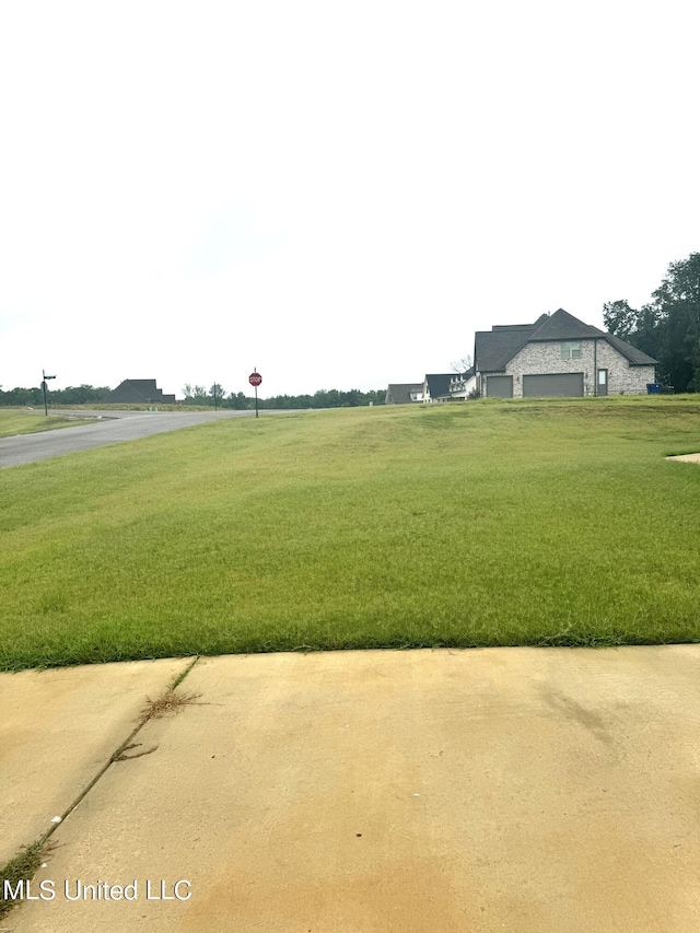 view of community featuring a yard