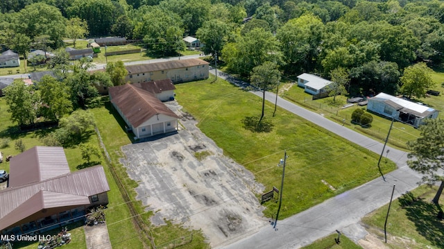 birds eye view of property featuring a wooded view