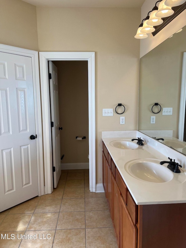 bathroom with vanity and tile patterned floors