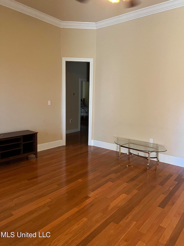 unfurnished room with hardwood / wood-style flooring and ornamental molding