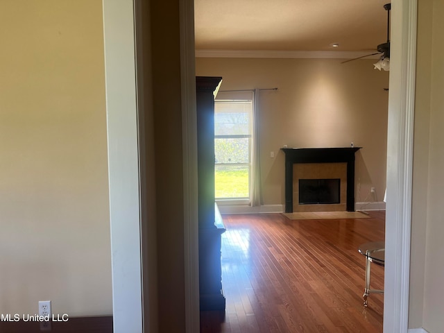 corridor featuring crown molding and hardwood / wood-style floors