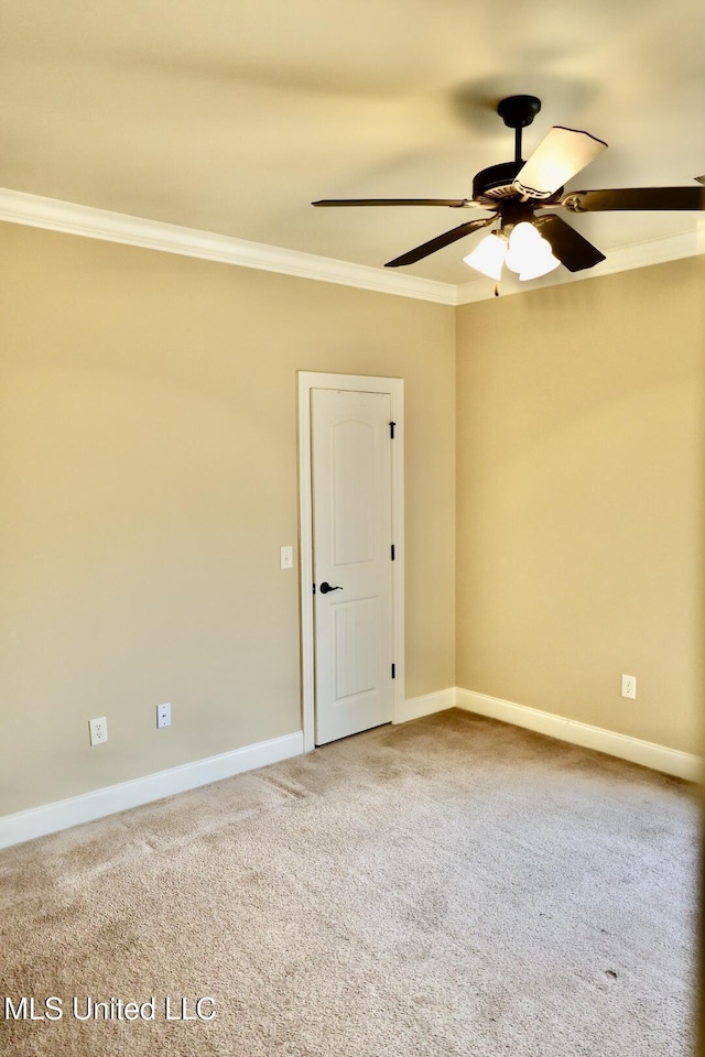 empty room with crown molding, baseboards, and a ceiling fan