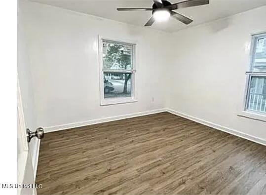 1325 Fourth Ave, Jackson, MS 39209 - empty room with baseboards, a ceiling fan, and dark wood-style floors