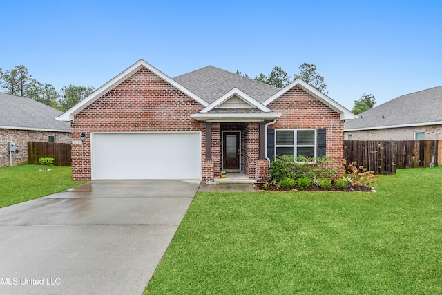 view of front of house featuring a garage and a front yard