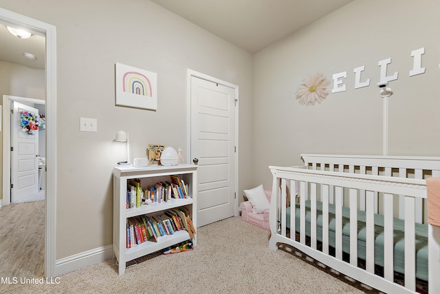 bedroom with a nursery area