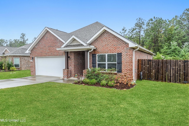 view of front of home featuring a front lawn and a garage