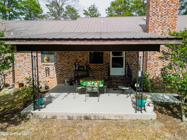 back of property with a patio area