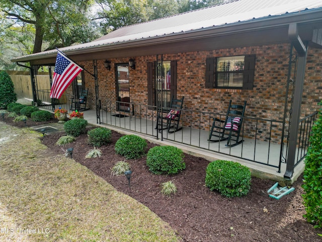 back of property with covered porch