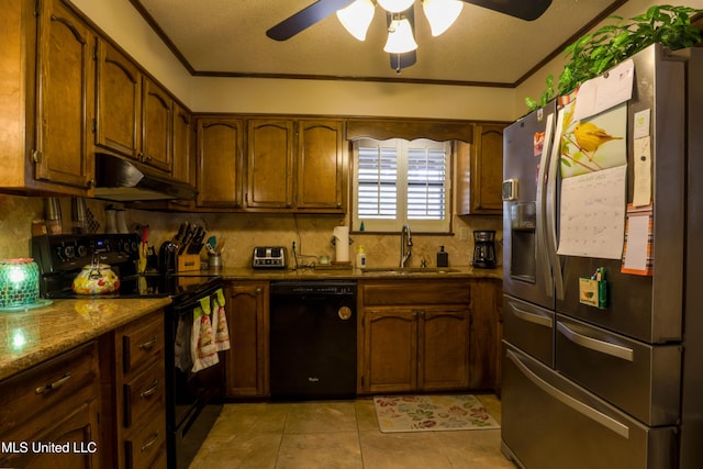 kitchen with sink, tasteful backsplash, light stone counters, ornamental molding, and black appliances