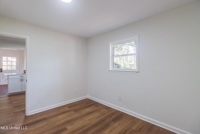 3217 Detroit Ave, Pascagoula, MS 39581 - spare room with dark wood-style flooring and baseboards