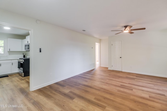 3217 Detroit Ave, Pascagoula, MS 39581 - empty room with light wood-style flooring, ceiling fan, baseboards, and a smoke detector