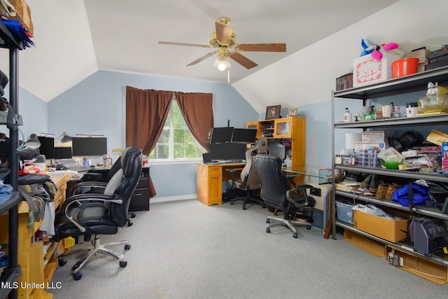 carpeted office featuring a ceiling fan and vaulted ceiling