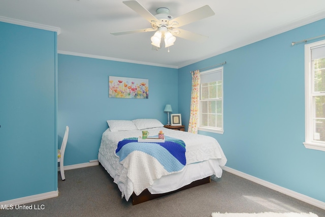 carpeted bedroom featuring ornamental molding, baseboards, and ceiling fan