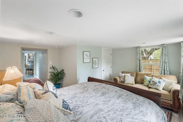 317 Ballentine St, Bay Saint Louis, MS 39520 - bedroom featuring wood finished floors