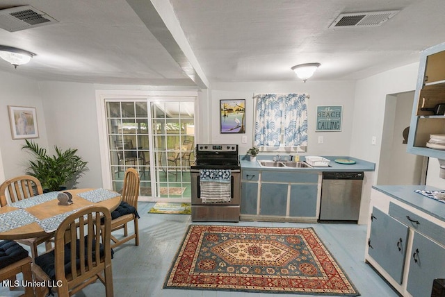 317 Ballentine St, Bay Saint Louis, MS 39520 - kitchen with appliances with stainless steel finishes, a sink, visible vents, and light wood-style floors