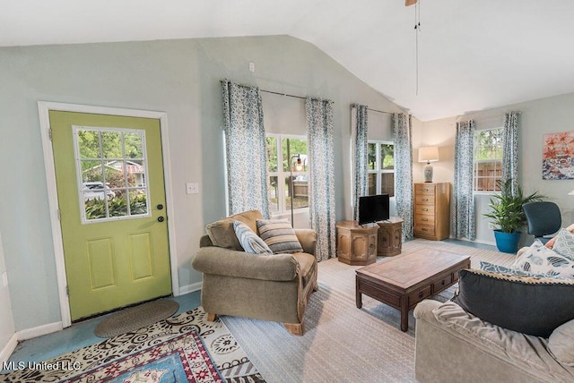 317 Ballentine St, Bay Saint Louis, MS 39520 - living area featuring vaulted ceiling, a wealth of natural light, and baseboards