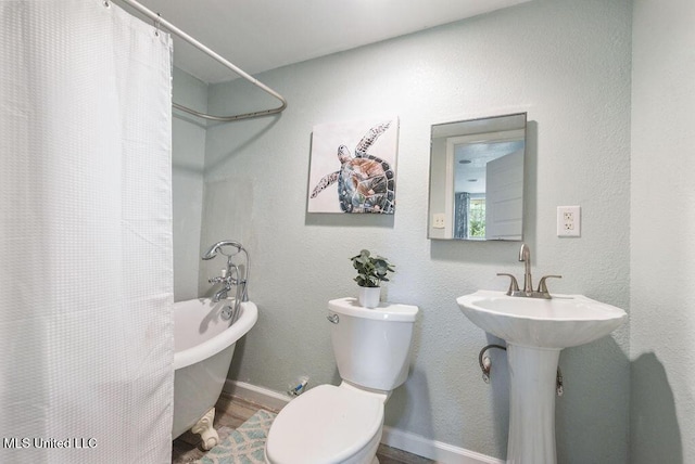 317 Ballentine St, Bay Saint Louis, MS 39520 - full bath with wood finished floors and toilet