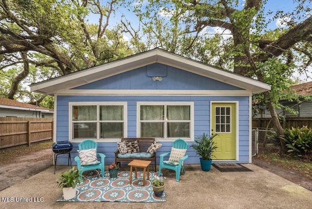 317 Ballentine St, Bay Saint Louis, MS 39520 - back of house with a patio area and a fenced backyard