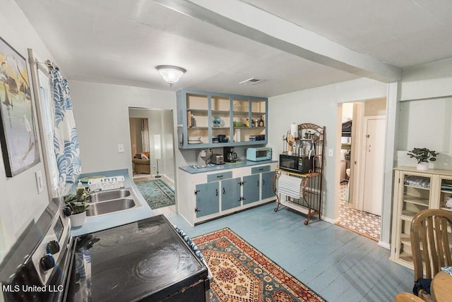 317 Ballentine St, Bay Saint Louis, MS 39520 - kitchen with dark wood-style floors, light countertops, visible vents, a sink, and black microwave