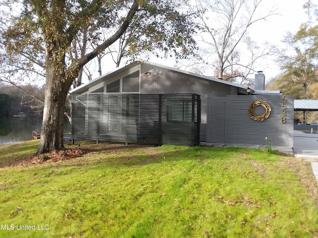 683B Cedar Hill Rd, Flora, MS 39071 - view of property exterior with a yard and a chimney