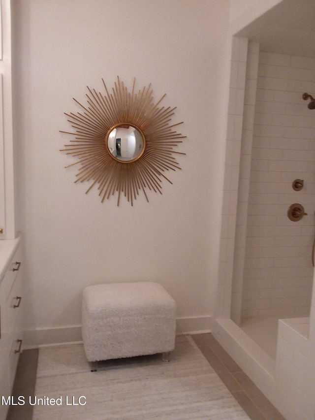 683B Cedar Hill Rd, Flora, MS 39071 - full bathroom featuring a tile shower and baseboards