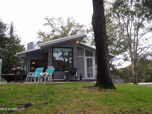 683B Cedar Hill Rd, Flora, MS 39071 - rear view of house with a chimney and a yard