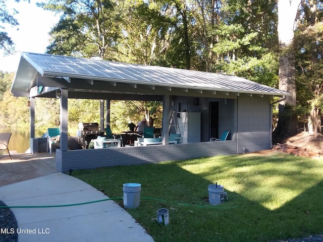 683B Cedar Hill Rd, Flora, MS 39071 - view of home's community with a lawn and a patio