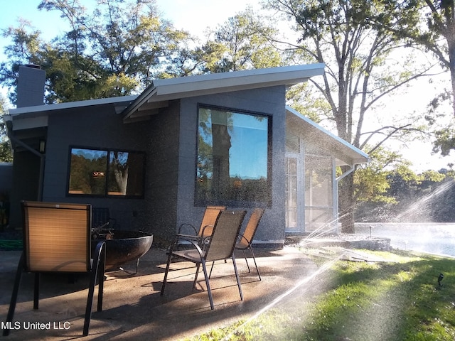 683B Cedar Hill Rd, Flora, MS 39071 - back of property featuring a patio and a chimney