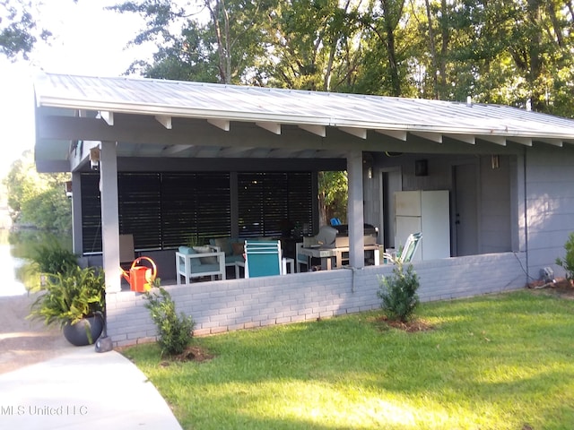 683B Cedar Hill Rd, Flora, MS 39071 - rear view of property with a lawn, an outdoor hangout area, and a patio area
