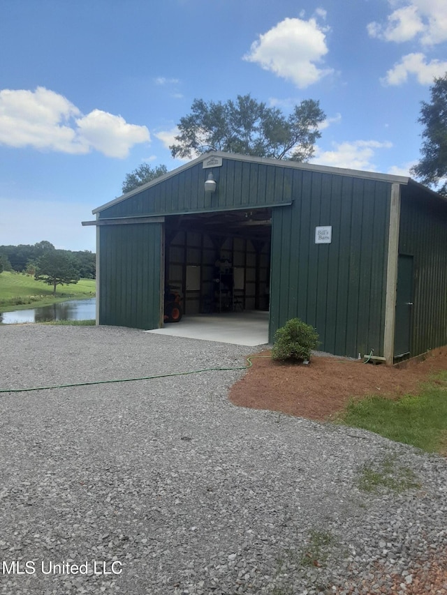 683B Cedar Hill Rd, Flora, MS 39071 - view of pole building with a water view and driveway