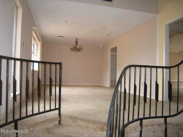 5019 Forest Hill Rd, Jackson, MS 39272 - stairs featuring carpet, a chandelier, and baseboards