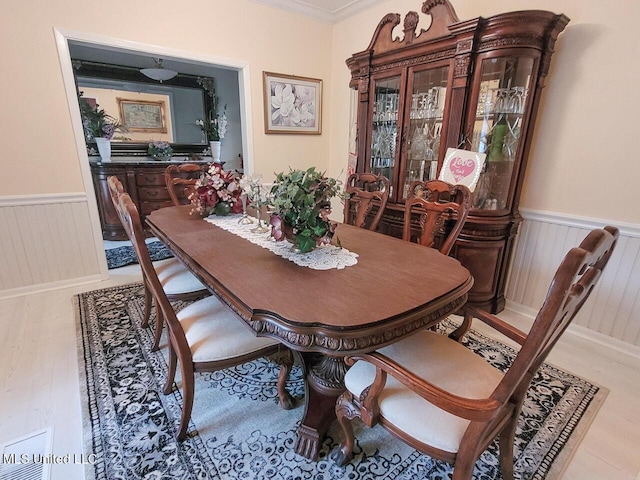 dining area with crown molding