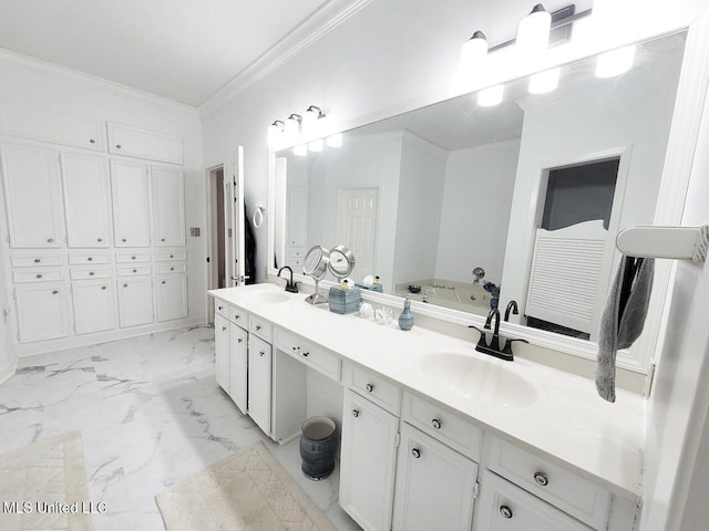 bathroom with a bath, vanity, and crown molding