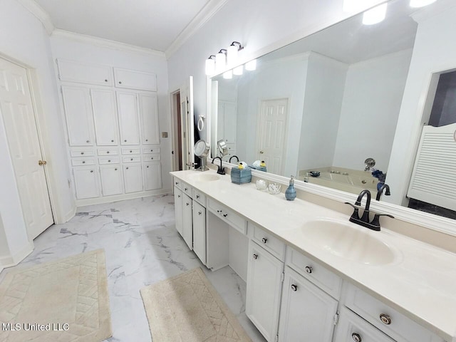 bathroom with a bath, vanity, and ornamental molding