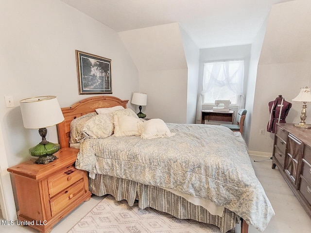 bedroom featuring vaulted ceiling