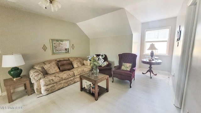 living room featuring lofted ceiling