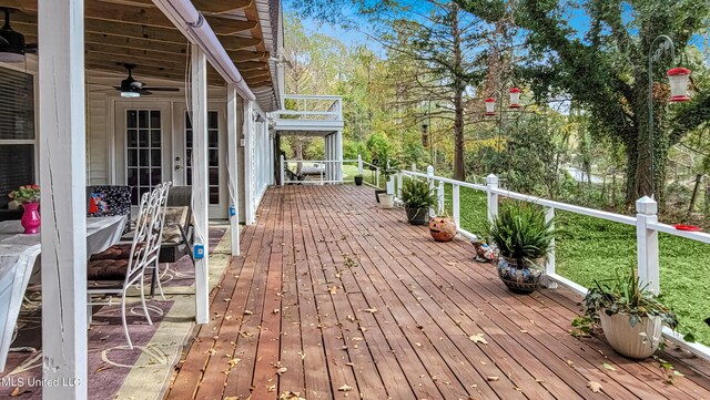 wooden deck with ceiling fan