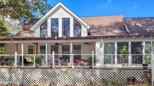 rear view of house with ceiling fan