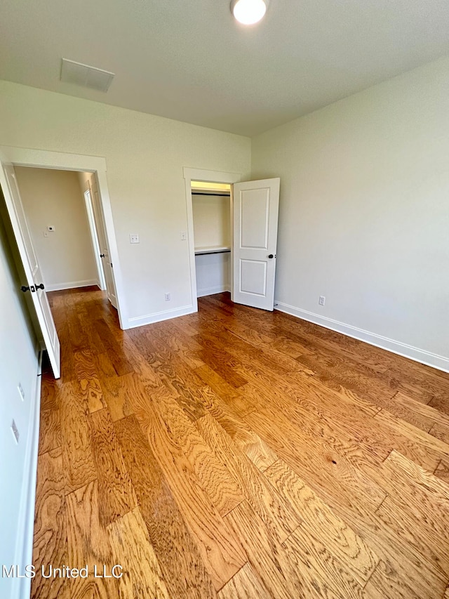 unfurnished bedroom with light hardwood / wood-style floors