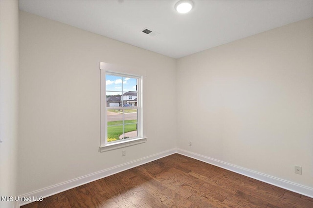 unfurnished room with hardwood / wood-style floors