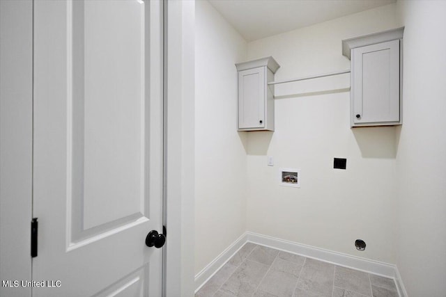 clothes washing area featuring cabinets and hookup for a washing machine