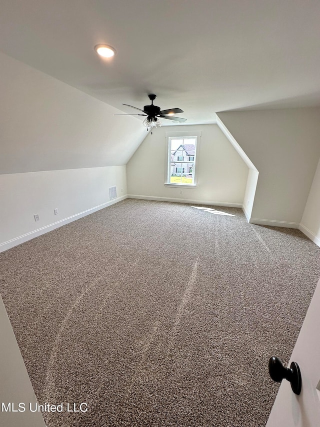 bonus room with ceiling fan, carpet, and vaulted ceiling