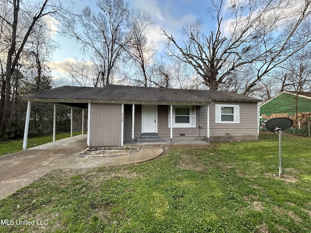 view of front of house with a front yard, crawl space, a carport, and concrete driveway