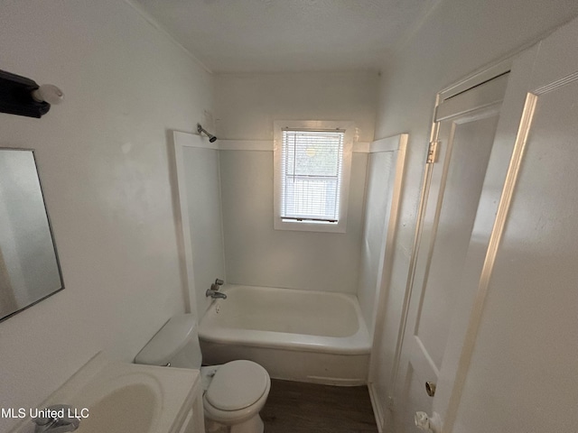 bathroom featuring bathing tub / shower combination, vanity, toilet, and wood finished floors
