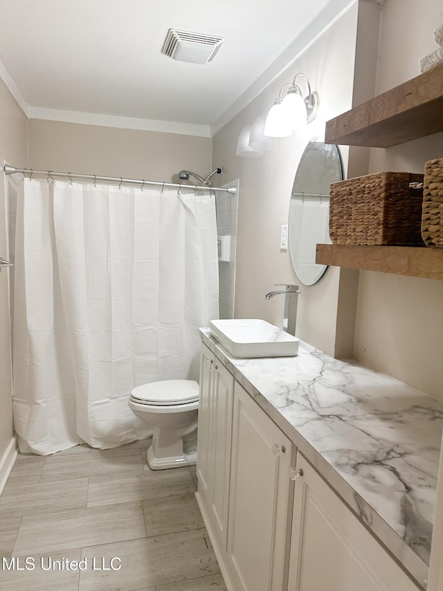 bathroom with vanity, ornamental molding, toilet, and a shower with shower curtain