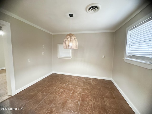 unfurnished dining area featuring crown molding