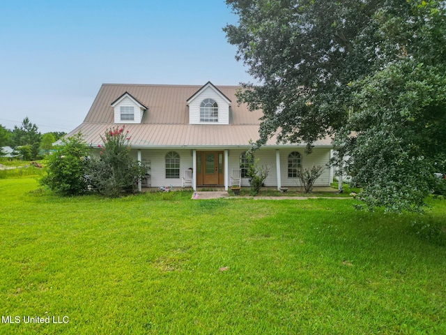 5421 Espy Ave, Long Beach, MS 39560 - view of front of home with covered porch, a front yard, and a metal roof