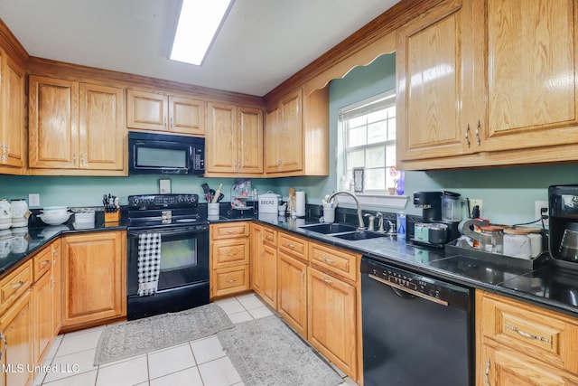 5421 Espy Ave, Long Beach, MS 39560 - kitchen with black appliances, dark countertops, and light tile patterned floors