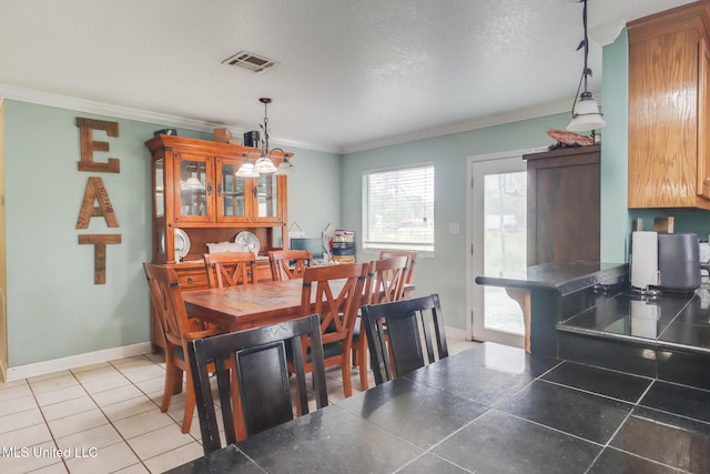 5421 Espy Ave, Long Beach, MS 39560 - dining space featuring ornamental molding and light tile patterned floors